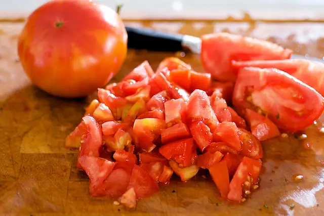 And chop up the tomatoes.