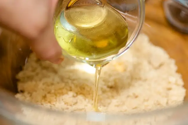 In a large bowl, add the sugar, canola oil or olive oil.