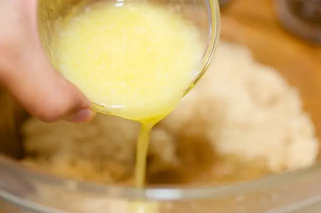 Pour the melted butter in.