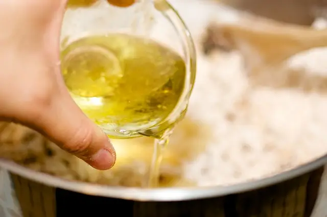 pour in the canola or olive oil,