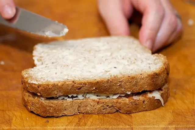 Top with second slice of bread and butter it. 