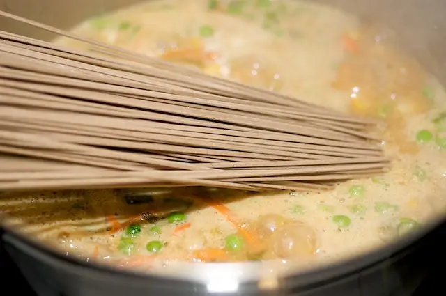 Add the soba noodles in, and make sure the noodles are under the stew.