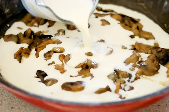 Reduce the heat to medium-low and add the cream or milk as your choice.