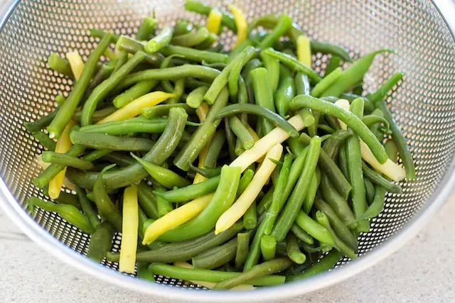 Drain the green beans in a colander and set aside.