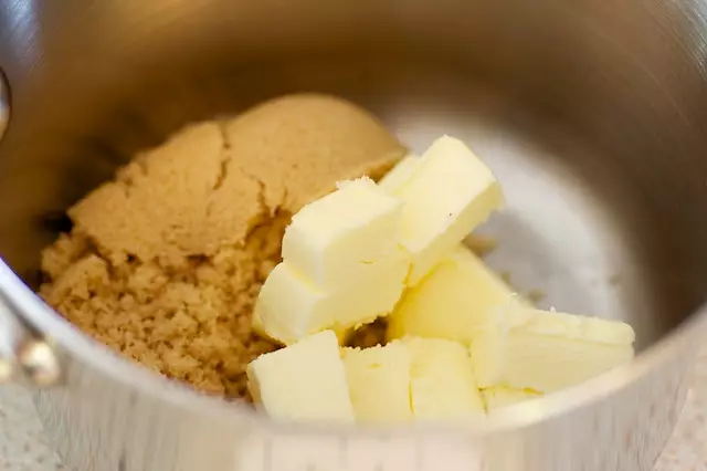 In a saucepan, add the butter and brown sugar.