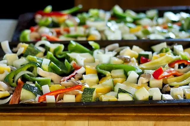 Toss the vegetables with olive oil, salt, black pepper and herbs in a large bowl, then spread onto one or two baking sheets.