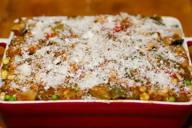Top with the remaining ⅓ cup Parmesan and butter pieces if needed. 