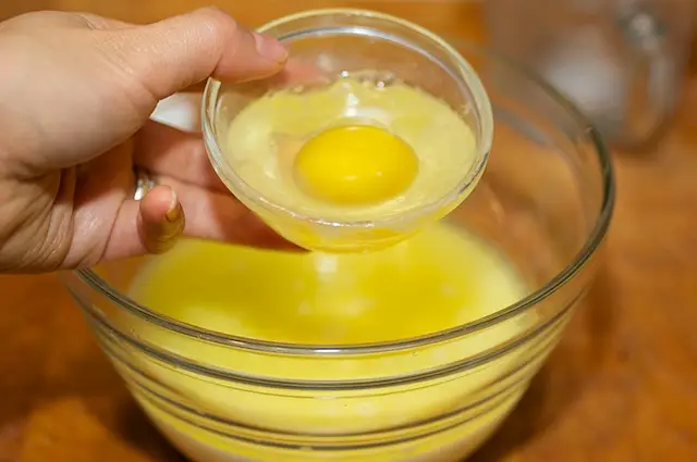 and the egg, whisk until well blended.