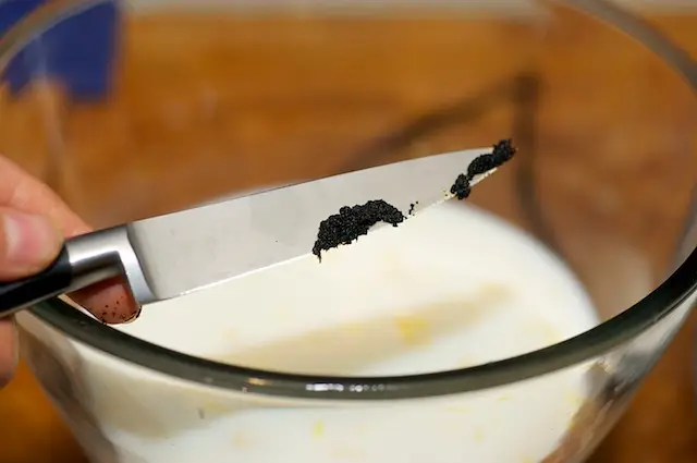Using a paring knife scrapes all the seeds out of the vanilla pot, add into the bowl.