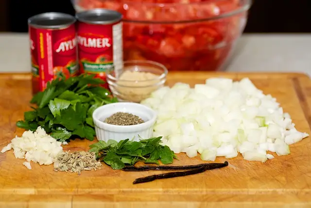 Get together the ingredients to make the tomato sauce first.