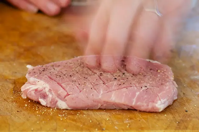 Season the pork with salt and black pepper.