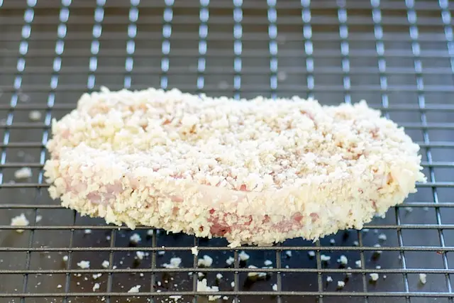 Place the prepared pork chops onto a wire rack that