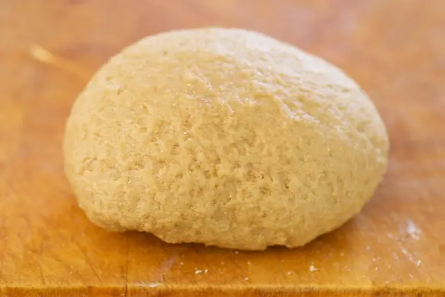 Use your hand to knead the dough a few times more until soft ball forms.