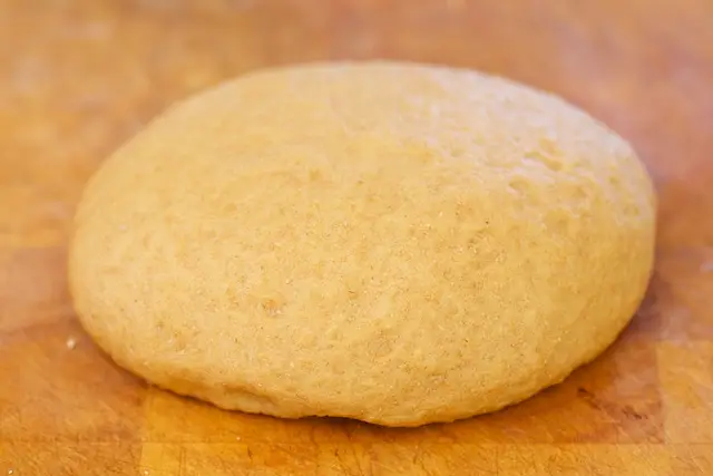 Coat the large bowl with cooking spray, place the dough into the bowl, and cover with plastic wrap or a clean and damp kitchen towel.