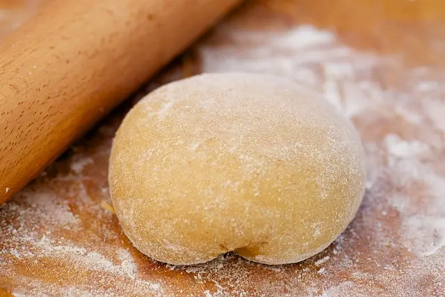 When the dough is ready, transfer it onto the floured surface,