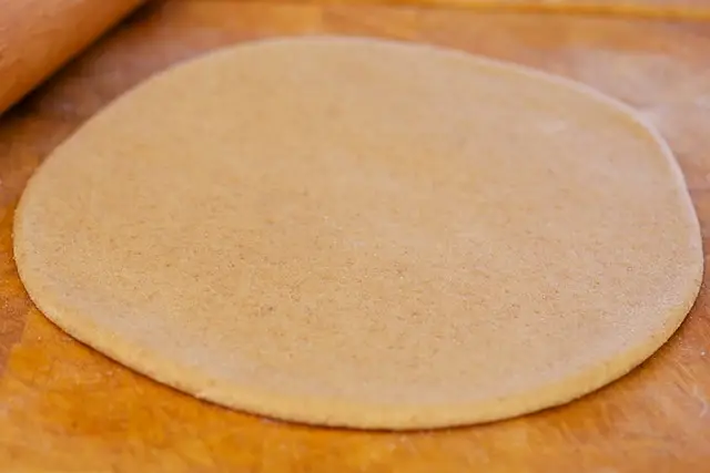 and roll out the dough into a 10-inch circle. 