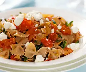 Warm Pasta with Roasted Tomatoes, Greens & Goat Cheese
