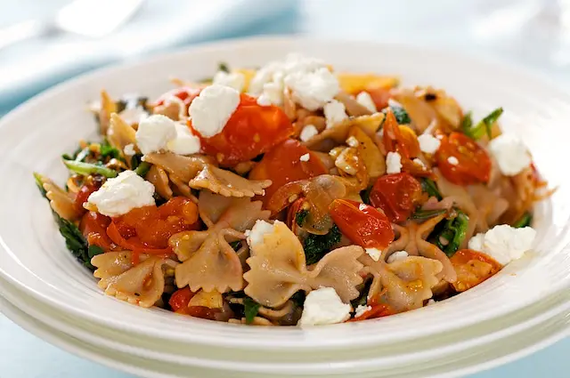 Warm Pasta with Roasted Tomatoes, Greens & Goat Cheese