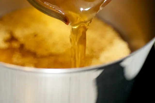 Transfer the toasted millet into a pot with the broth. 