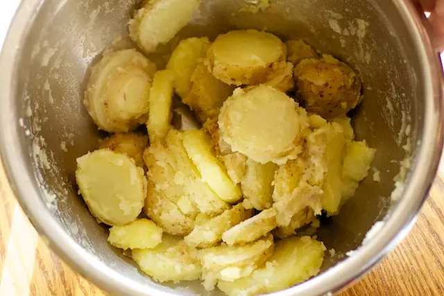 Cooking and tossing potato...