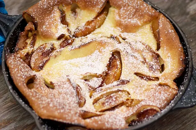 Dust some powdered sugar over the pancake and serve warm.
