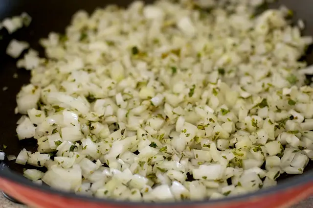 Sauté 4 minutes or until onion begins to brown. 