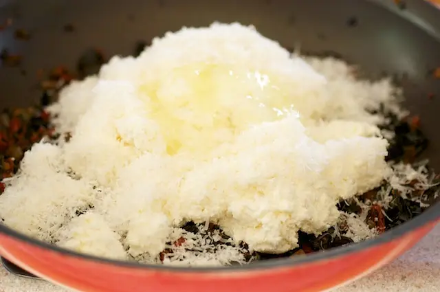 Add cheeses, salt, pepper, and egg white.