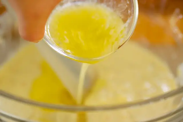 In a large bowl, add the cream style corn, melted butter or fat.