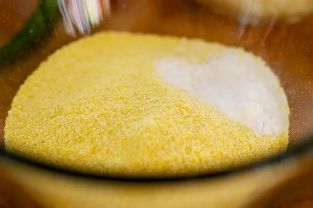 In another bowl, whisk together the cornmeal, baking soda and salt.