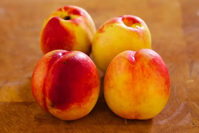 Next wash a few fresh peaches.