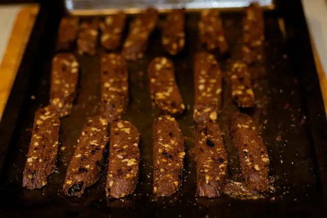 Stand the slices upright on edge on the prepared cookie sheet.