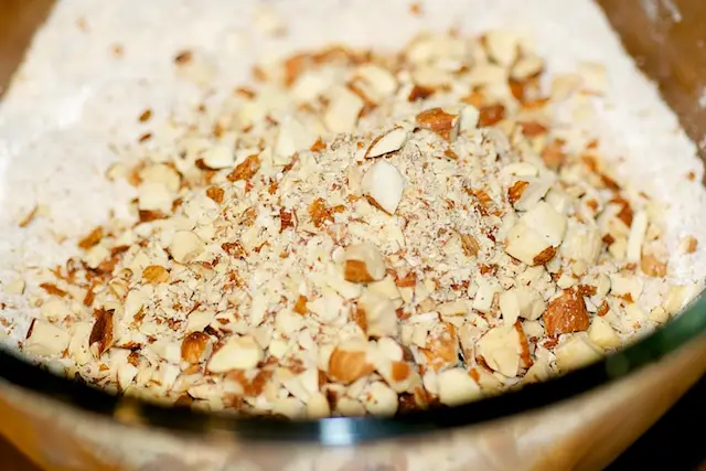 Add toasted almonds and chop coarsely, using 6 to 8 on/off turns. 