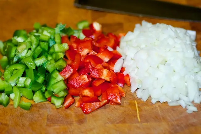 Next chop the bell peppers and onions.