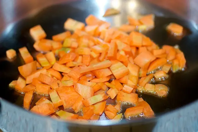 Add the carrots into a hot wok with a little oil,