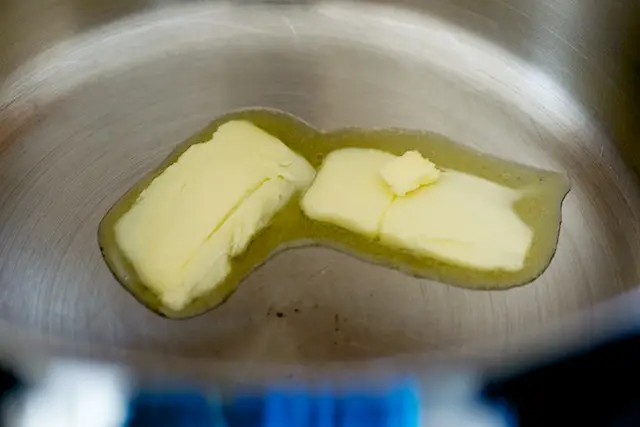 Melt butter in Dutch oven over high heat. 