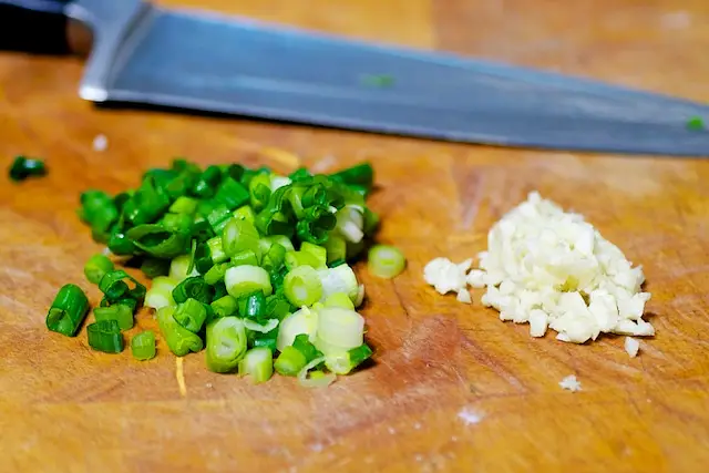 Chop the scallions and garlic if using.