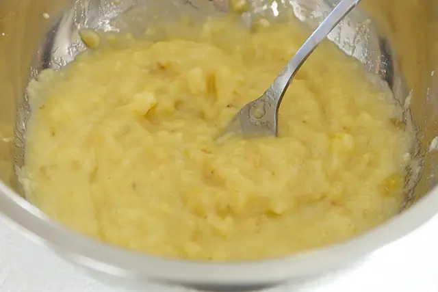 Mash the banana with a fork.