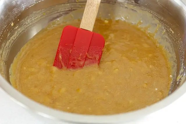 Add the mashed bananas into the creamed butter and sugar, beat well.