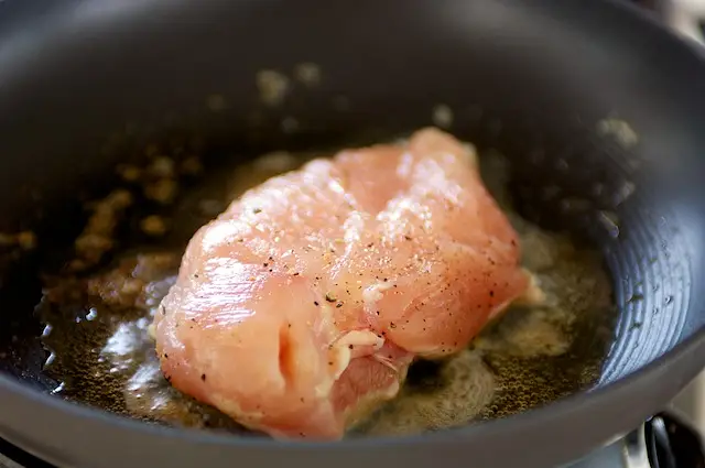 First prepare and cook the chicken breasts.
