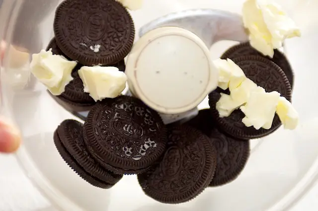 If using cookies, put them in a food processor along with butter.