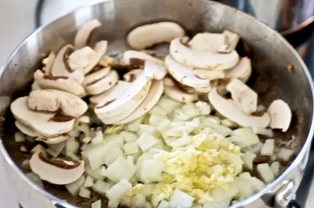 Add the onion, garlic and mushrooms.