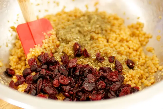 Transfer the cooked couscous to a large bowl 