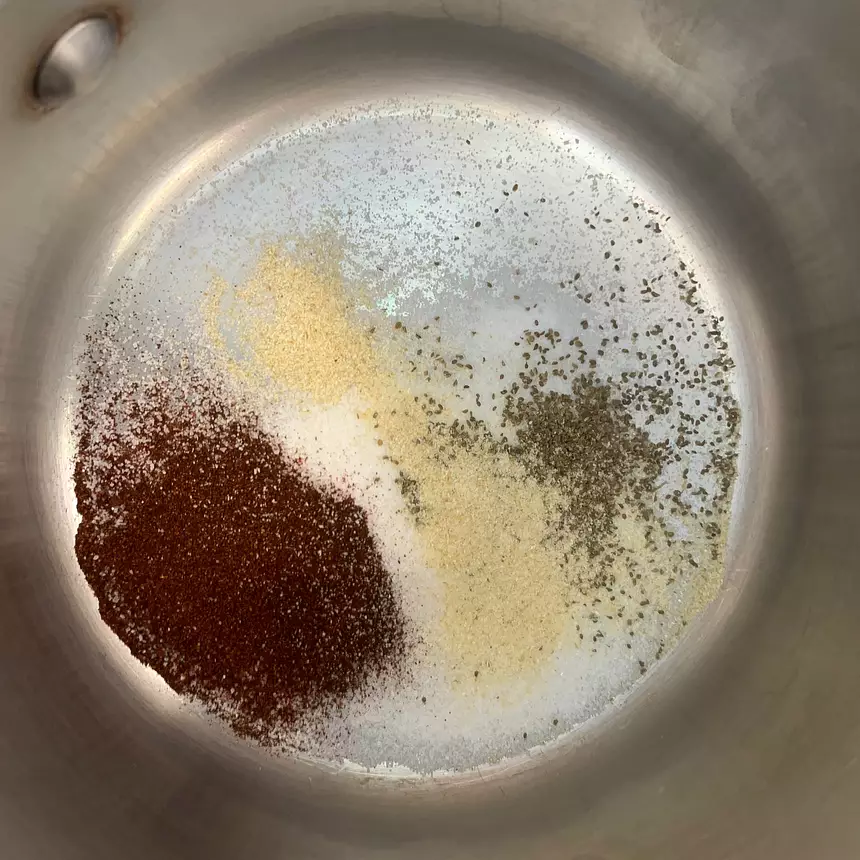 Sugar, paprika, celery seed, onion powder and salt in a pot