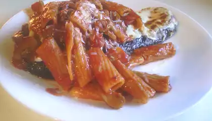 Rigatoni Pasta Over Eggplant Parmesan