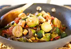 Tomato Braised Brussel Sprouts with Pine Nuts and Croutons