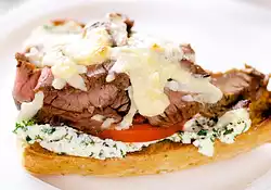 Open-face Flank Steak Sandwiches with Herbed Goat Cheese and Tomatoes