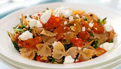 Warm Pasta with Roasted Tomatoes, Greens and Goat Cheese