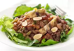 Five Bean, Artichoke and Sundried Tomato Salad with Greens and Toasted Almonds