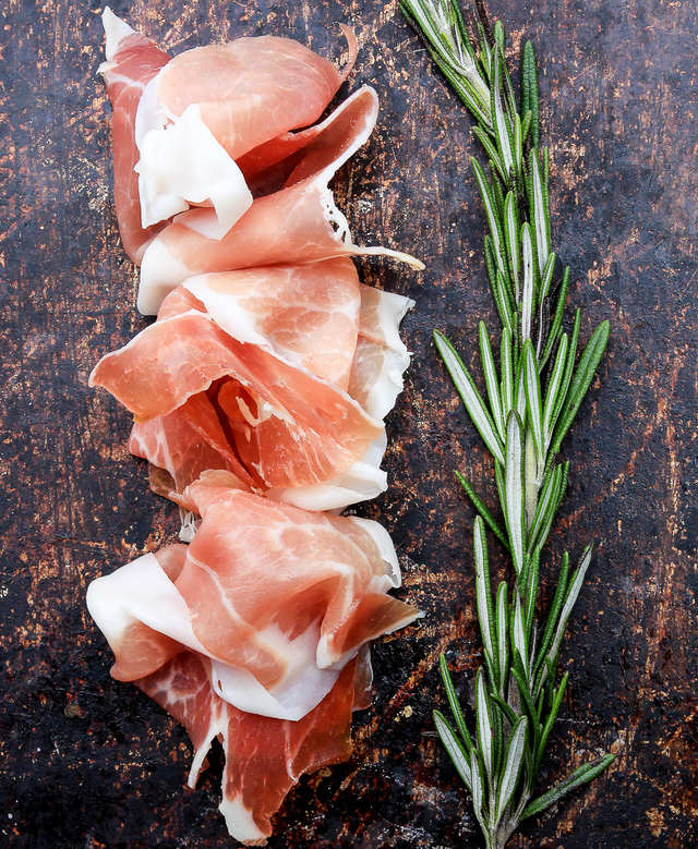 prosciutto with rosemary sprig