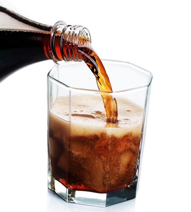 cola soda pouring into glass